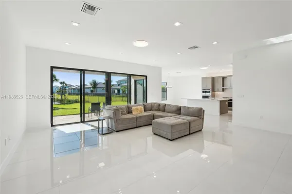 a living room with furniture and a large window