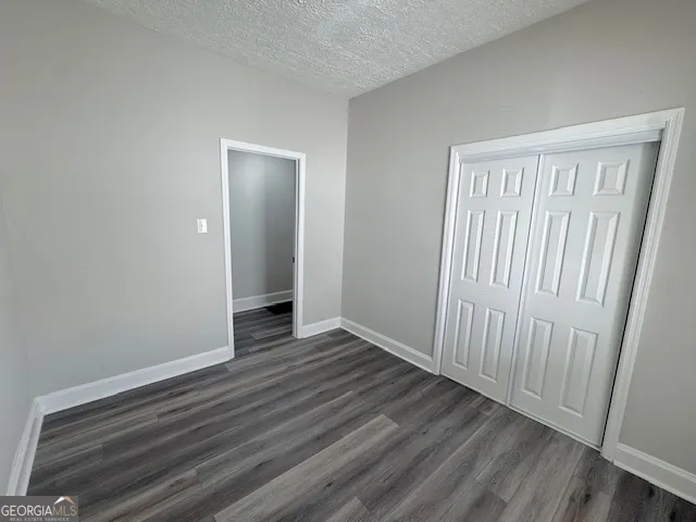 a view of a livingroom with wooden floor