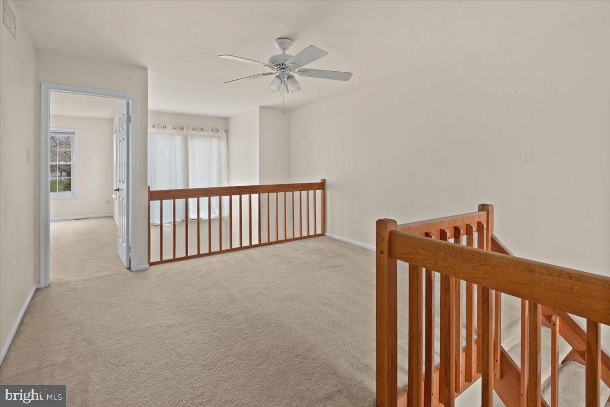 36 Needham Way Princeton, NJ 08540 - Photo 14 of 27 a view of a hallway with a ceiling fan
