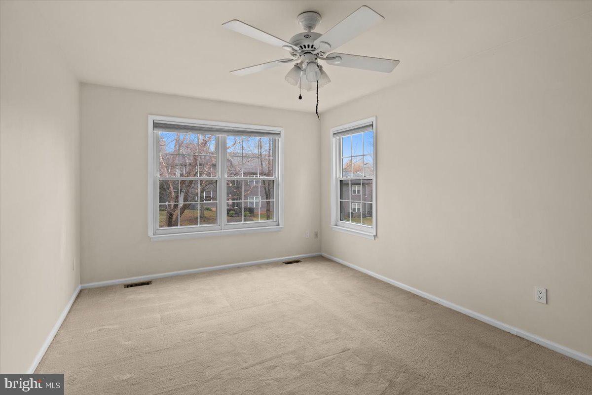 36 Needham Way Princeton, NJ 08540 - Photo 17 of 27 an empty room with windows and fan