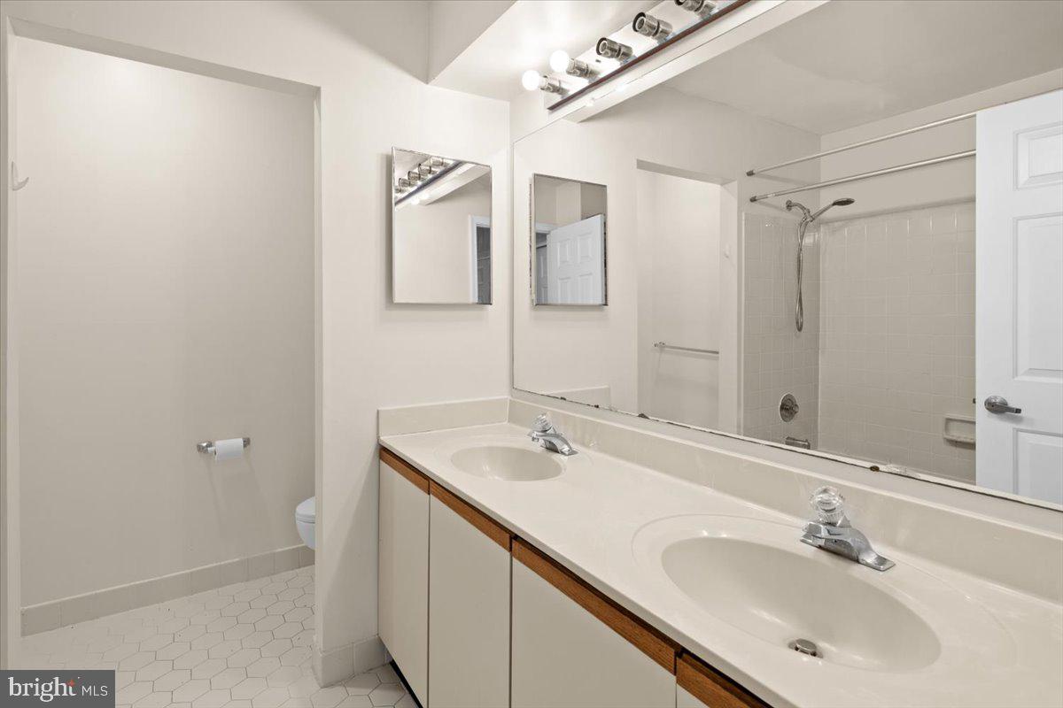 36 Needham Way Princeton, NJ 08540 - Photo 20 of 27 a bathroom with a sink and a mirror
