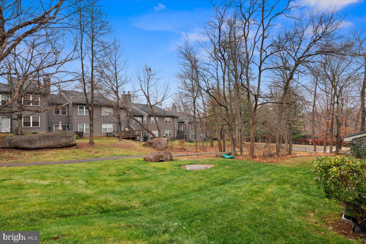 36 Needham Way Princeton, NJ 08540 - Photo 27 of 27 a view of a backyard with a large tree