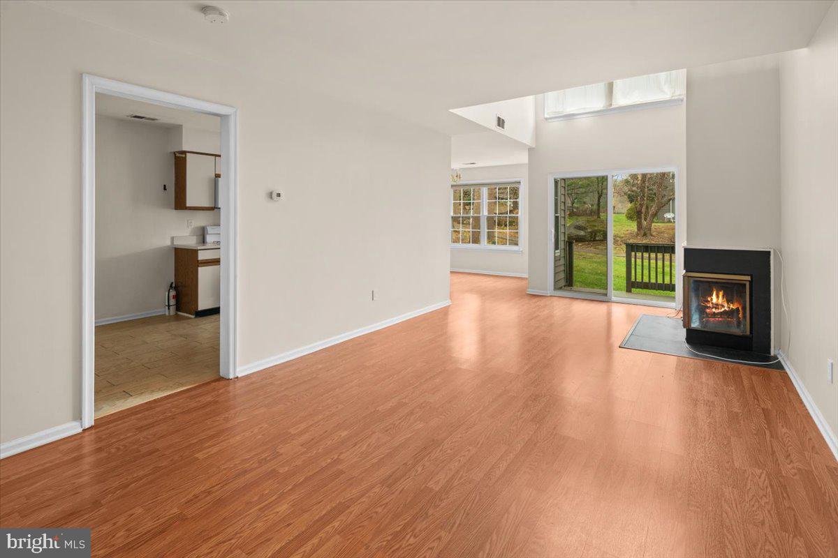 36 Needham Way Princeton, NJ 08540 - Photo 4 of 27 a view of a room with wooden floor and a fireplace
