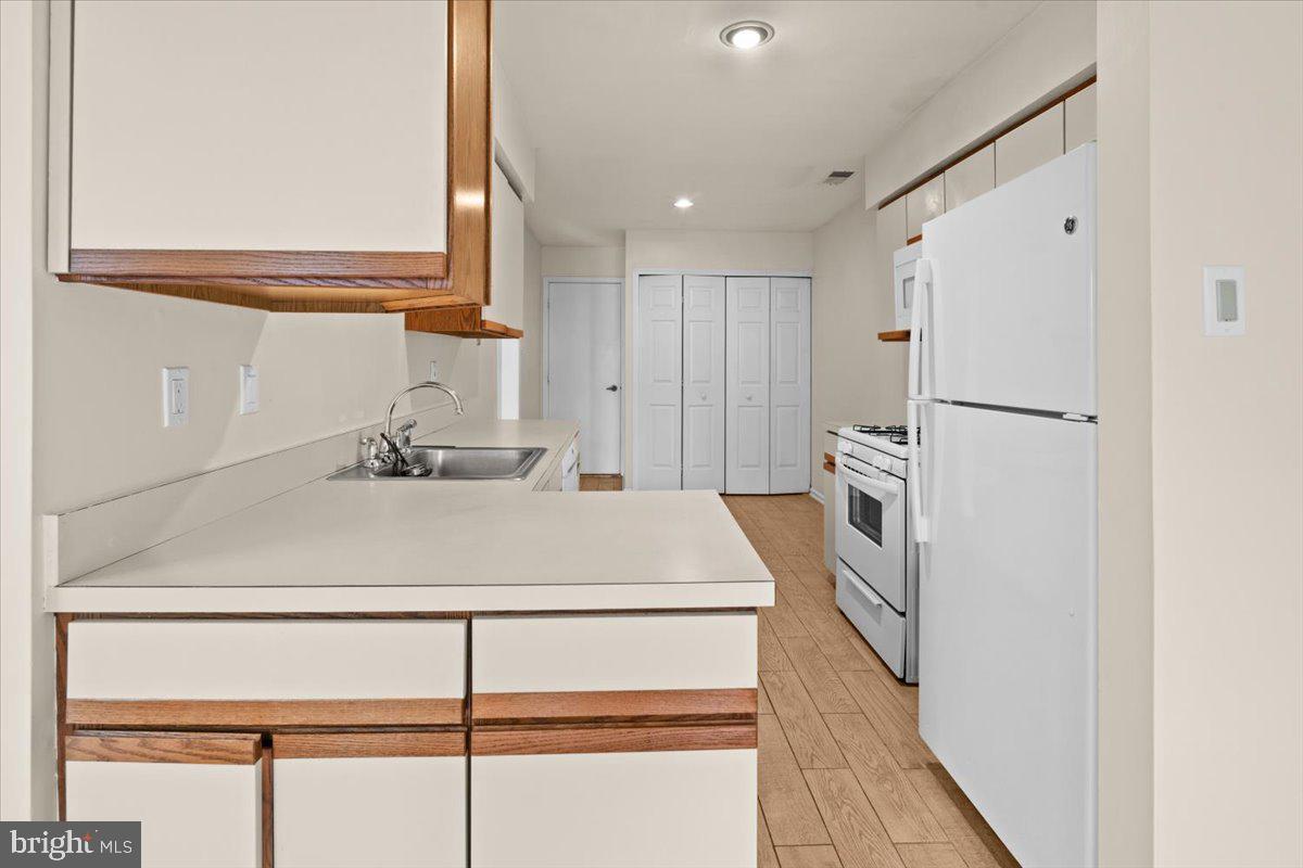 36 Needham Way Princeton, NJ 08540 - Photo 8 of 27 a kitchen with a refrigerator sink and cabinets