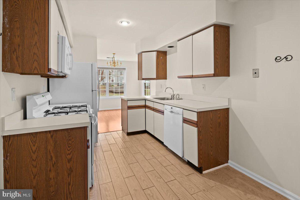 36 Needham Way Princeton, NJ 08540 - Photo 10 of 27 a kitchen with a sink stove and cabinets