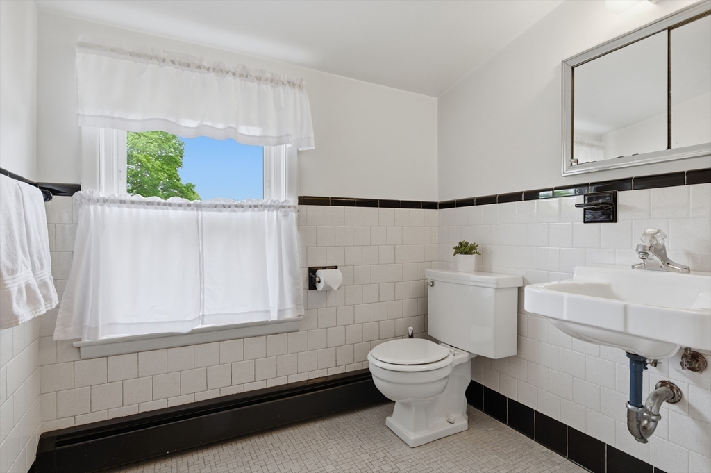 188 Glendale Road Attleboro, MA 02703 - Photo 20 of 37 a bathroom with a toilet sink and mirror
