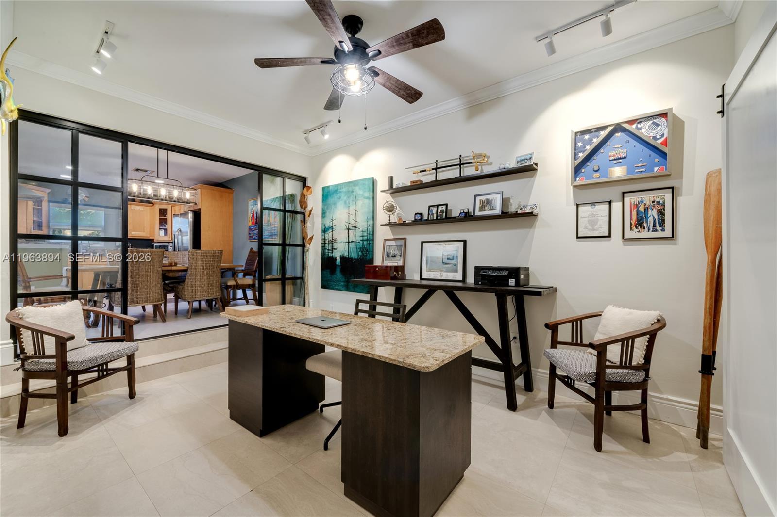 3197 Virginia Street Miami, FL 33133 - Photo 12 of 22 a view of a livingroom with furniture and a ceiling fan