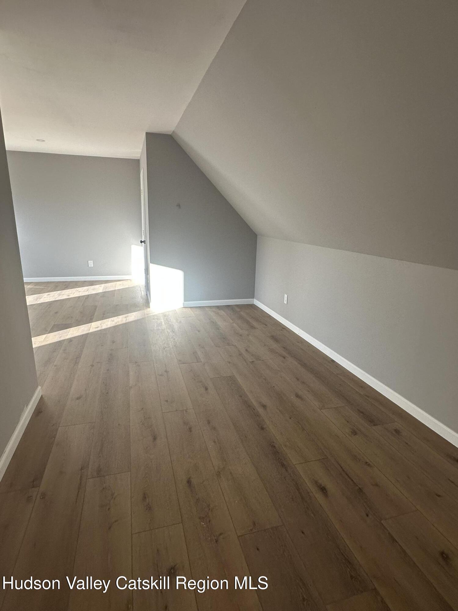 35 Olivers Way Cairo, NY 12413 - Photo 15 of 22 an empty room with wooden floor