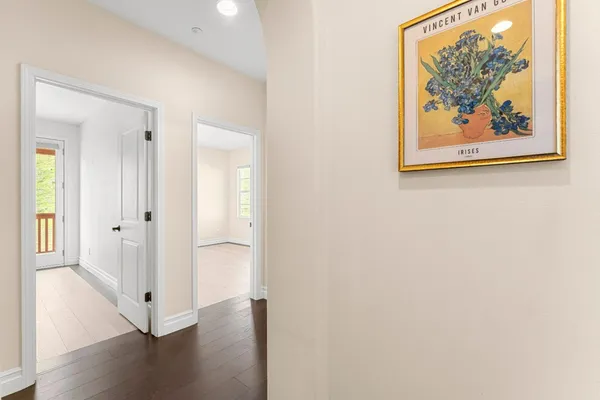 a bathroom with a double vanity sink a toilet and a mirror