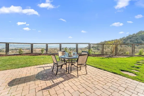 a view of a golf course with a tree