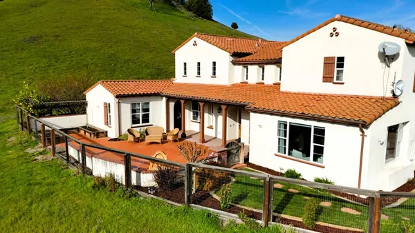 a view of a swimming pool with a patio