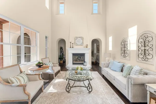 a view of a livingroom with furniture and hardwood floor