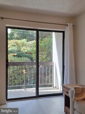 a view of a room that has a large window