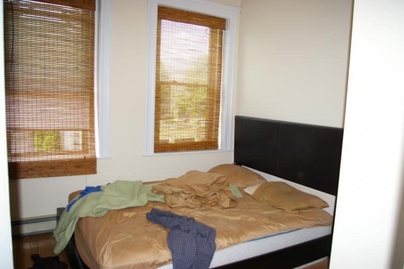 12 Ransom Road, Unit 6 Boston, MA 02135 - Photo 9 of 16 a bedroom with a bed and a window