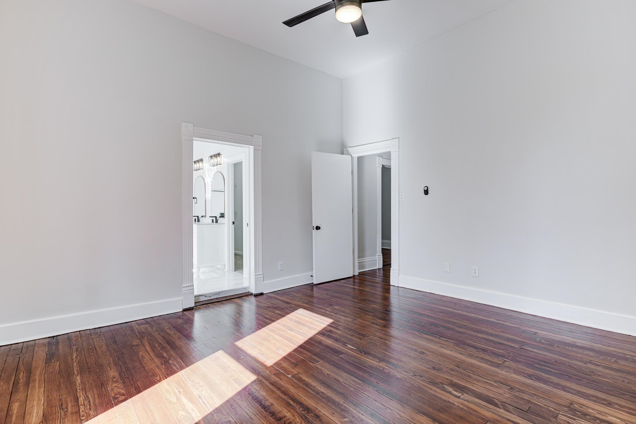 843 South Main Street Covington, TN 38019 - Photo 13 of 25 an empty room with wooden floor and windows