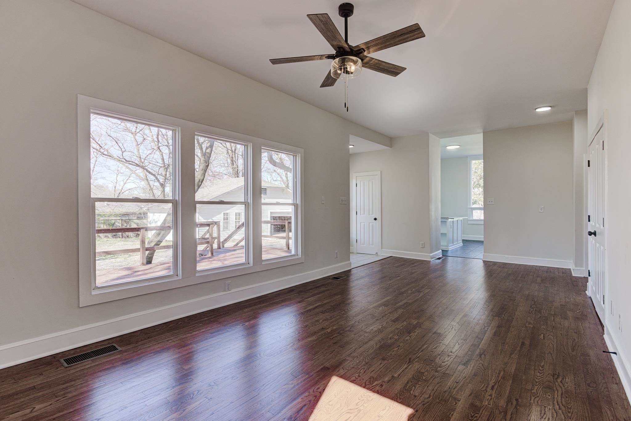 843 South Main Street Covington, TN 38019 - Photo 14 of 25 a view of an empty room with wooden floor and a window