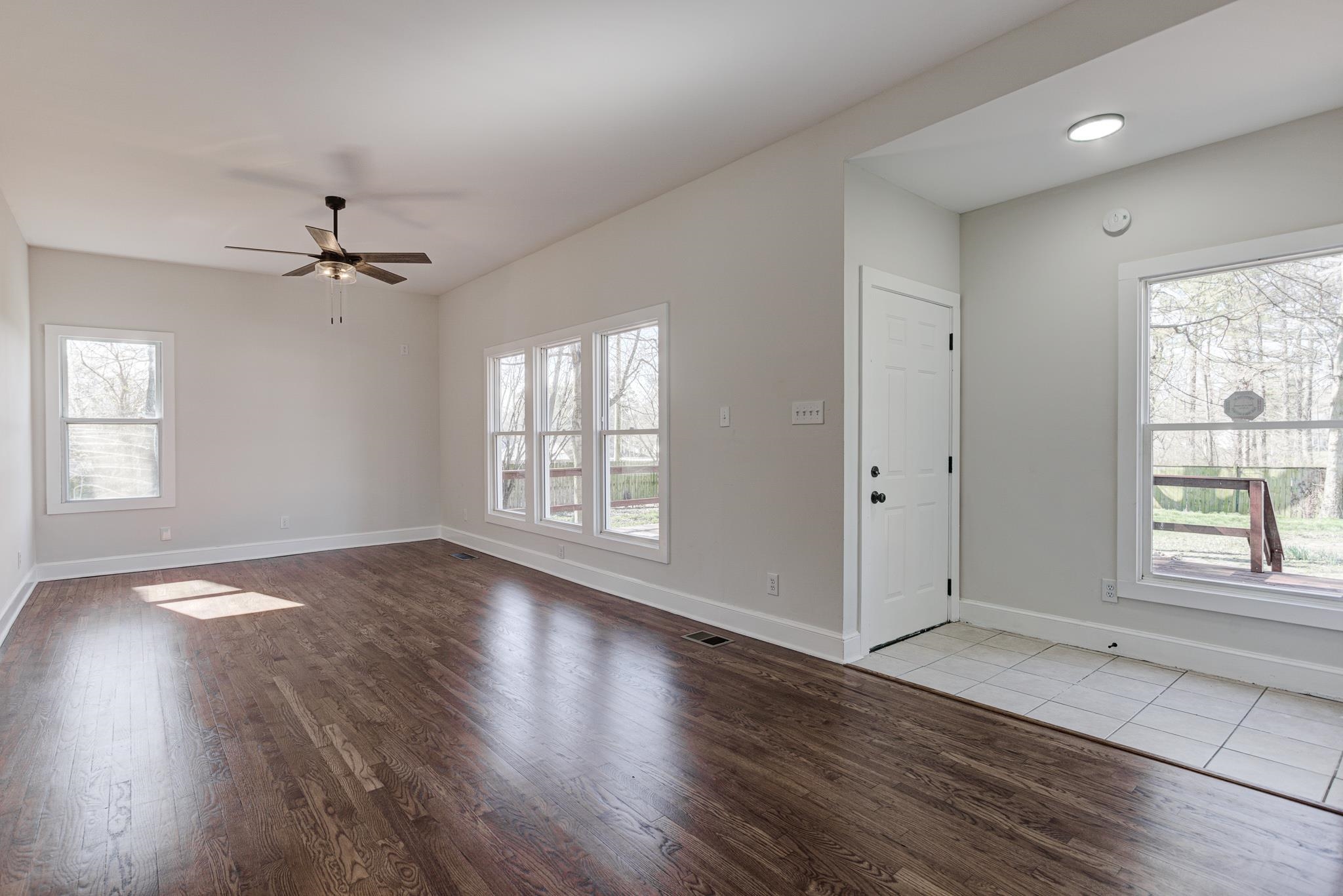 843 South Main Street Covington, TN 38019 - Photo 15 of 25 wooden floor in an empty room with a window
