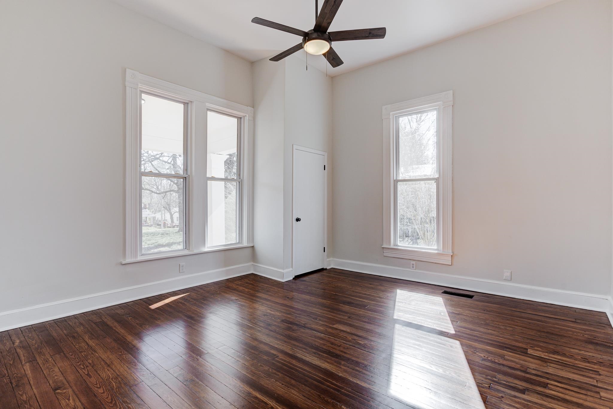 843 South Main Street Covington, TN 38019 - Photo 16 of 25 a view of an empty room with wooden floor and a window