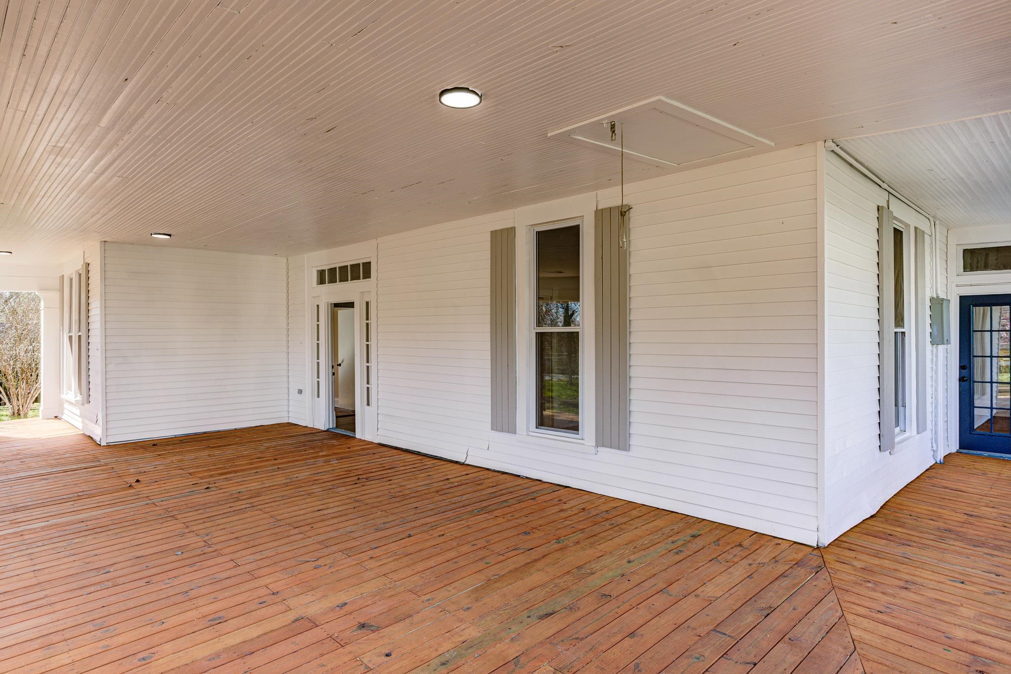843 South Main Street Covington, TN 38019 - Photo 2 of 25 a view of an empty room with wooden floor and a window