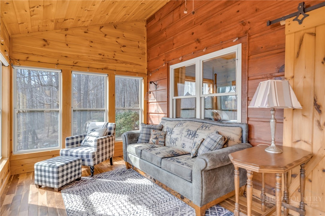 7994 3 Top Road Todd, NC 28684 - Photo 15 of 50 a living room with furniture and a large window