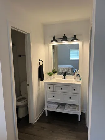 a view of closet with wooden floor