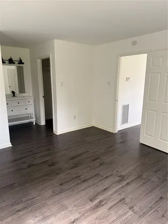 a view of livingroom with hardwood floor and hallway