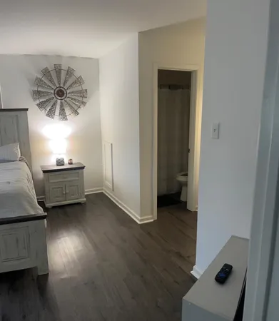 a view of a livingroom with furniture and a window