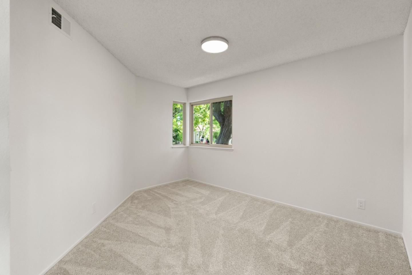 8356 Charbono Court San Jose, CA 95135 - Photo 12 of 48 an empty room with windows