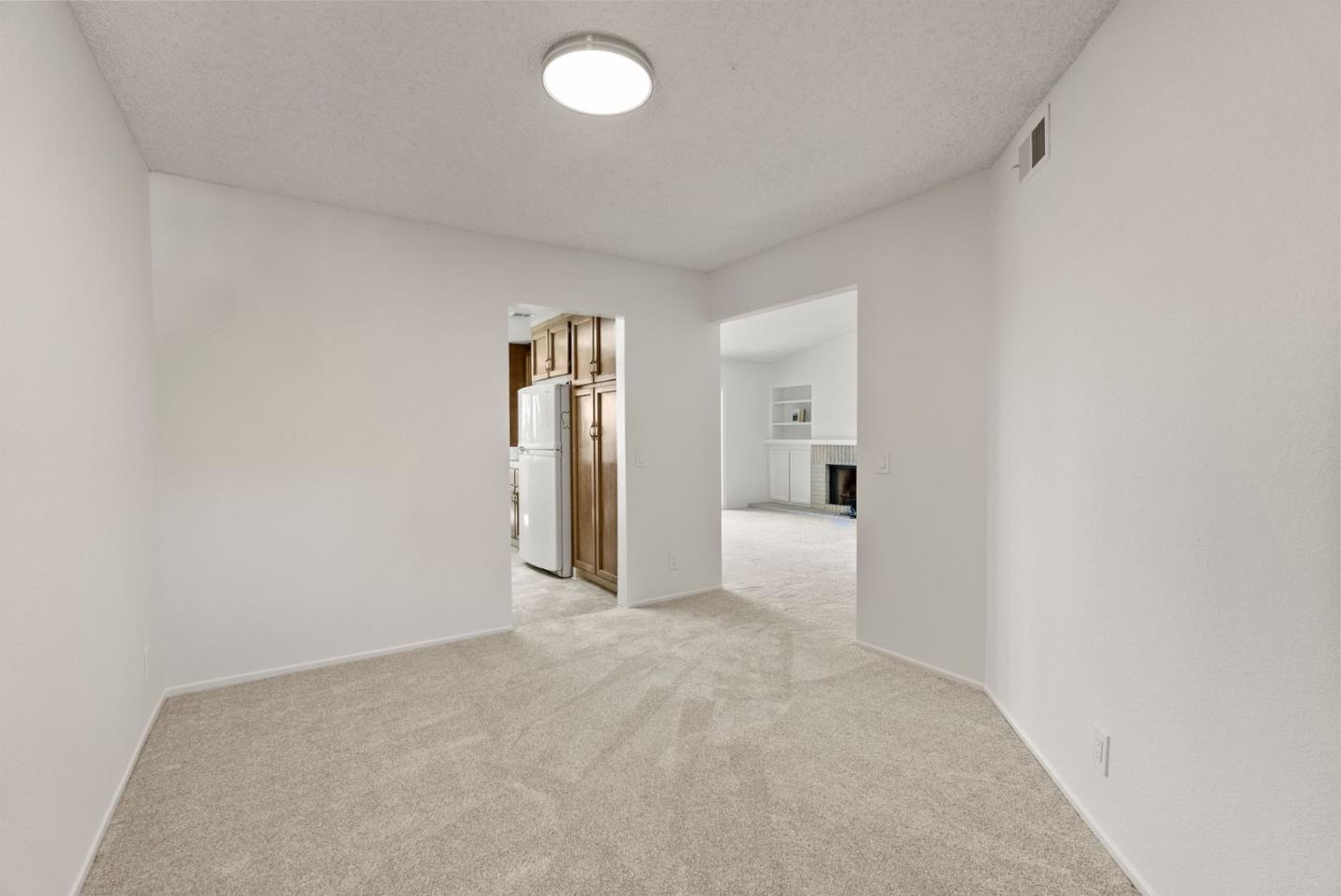 8356 Charbono Court San Jose, CA 95135 - Photo 13 of 48 a view of a big room with a fireplace