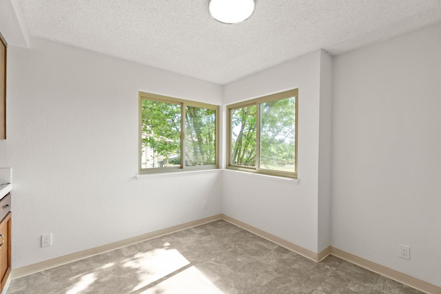 8356 Charbono Court San Jose, CA 95135 - Photo 14 of 48 an empty room with windows