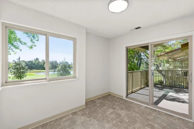 a view of a room with a large window