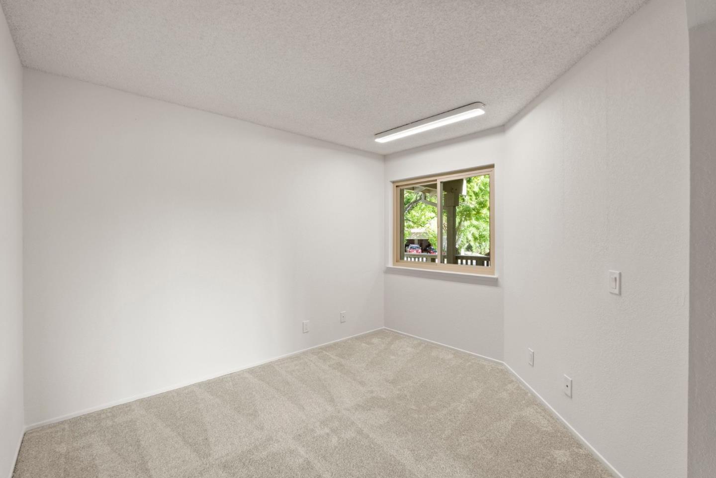 8356 Charbono Court San Jose, CA 95135 - Photo 16 of 48 an empty room with windows