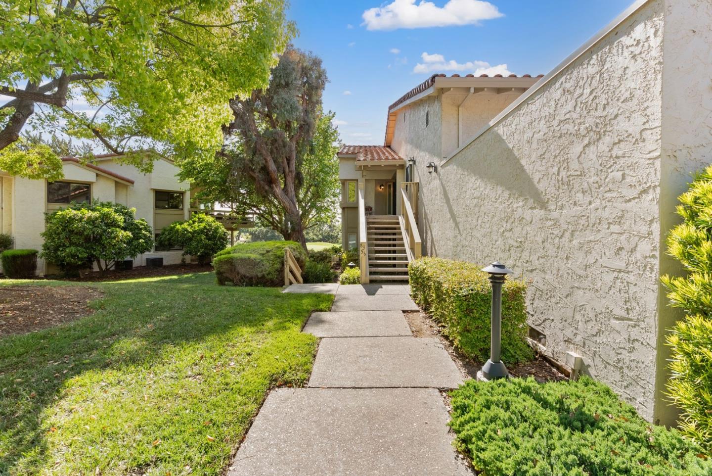 8356 Charbono Court San Jose, CA 95135 - Photo 2 of 48 a front view of a house with garden