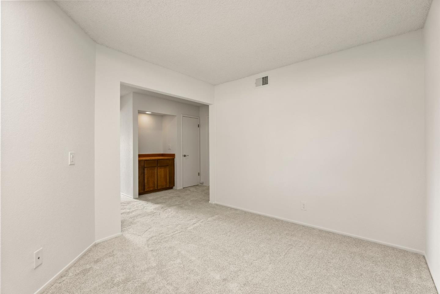 8356 Charbono Court San Jose, CA 95135 - Photo 23 of 48 a view of an empty room with a window