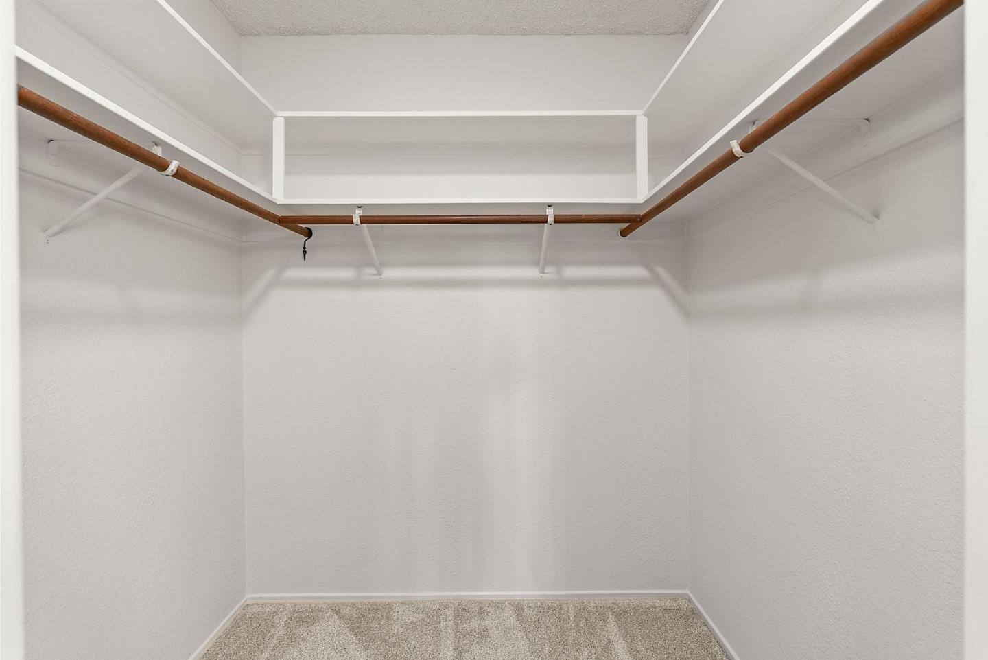 8356 Charbono Court San Jose, CA 95135 - Photo 26 of 48 a view of walk in closet with empty racks