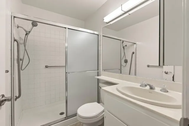 a bathroom with a double vanity sink mirror and