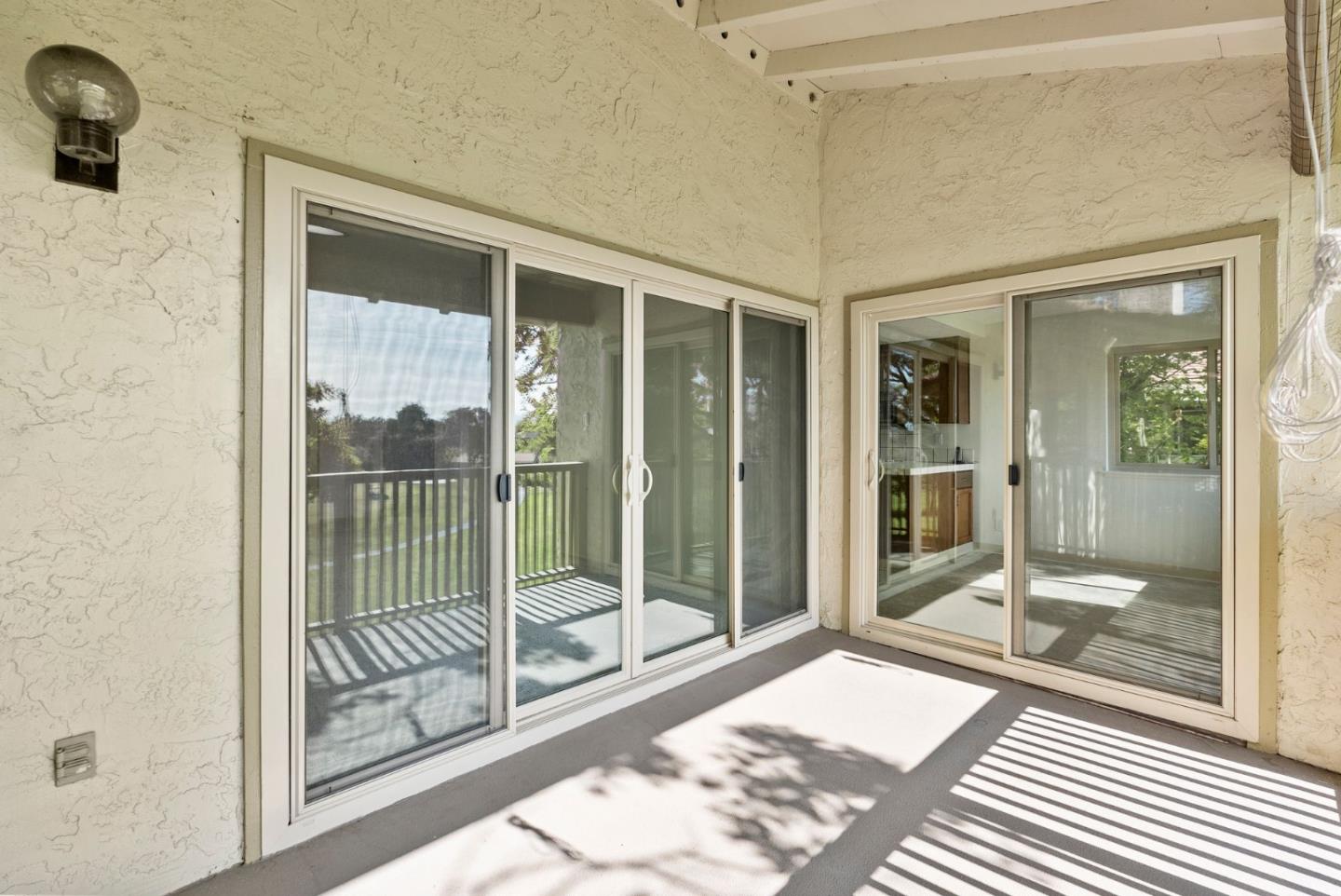 8356 Charbono Court San Jose, CA 95135 - Photo 31 of 48 a view of a bathroom with a glass door and a window