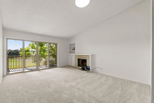 a view of a room with a large window