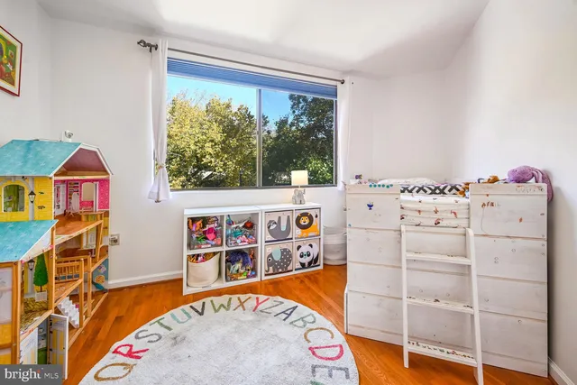 a utility room with dryer washer and a view of living room