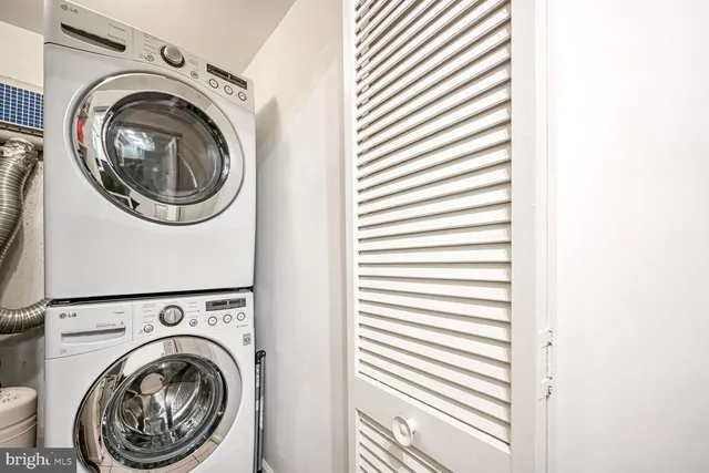 a view of a hallway with washer and dryer
