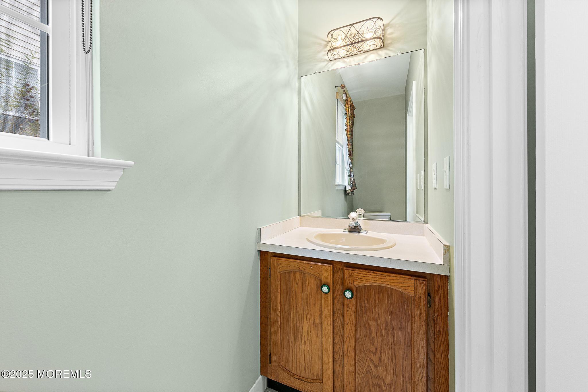 6 Lafayette Colts Neck Colts Neck, NJ 07722 - Photo 23 of 43 a bathroom with a sink and a mirror