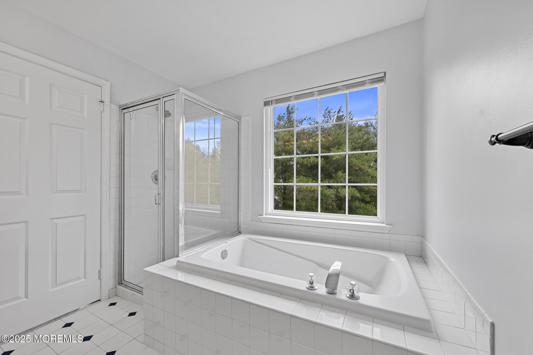 6 Lafayette Colts Neck Colts Neck, NJ 07722 - Photo 25 of 43 a bathroom with a tub and a window