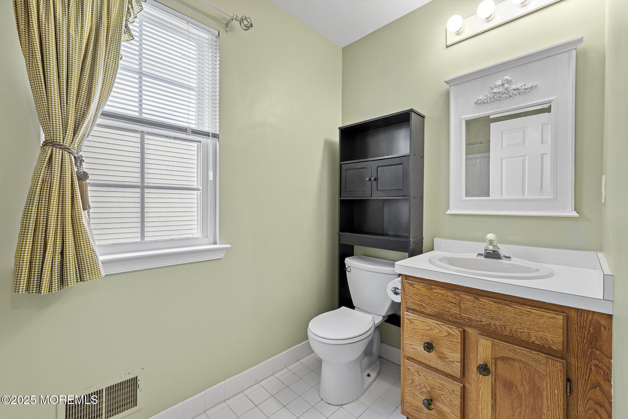 6 Lafayette Colts Neck Colts Neck, NJ 07722 - Photo 26 of 43 a bathroom with a toilet sink and mirror