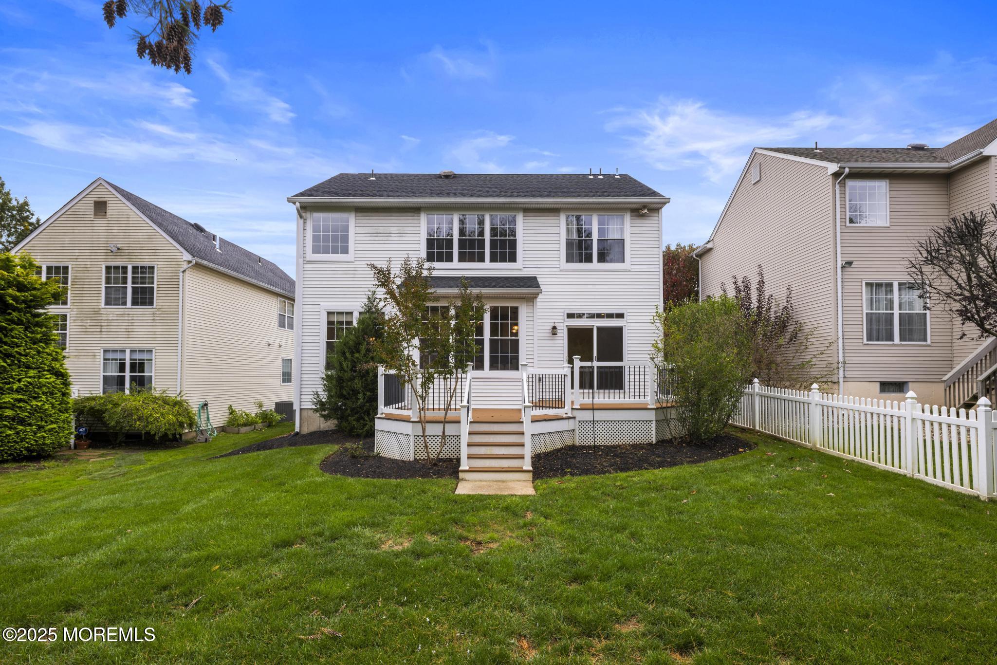 6 Lafayette Colts Neck Colts Neck, NJ 07722 - Photo 31 of 43 a front view of a house with a garden