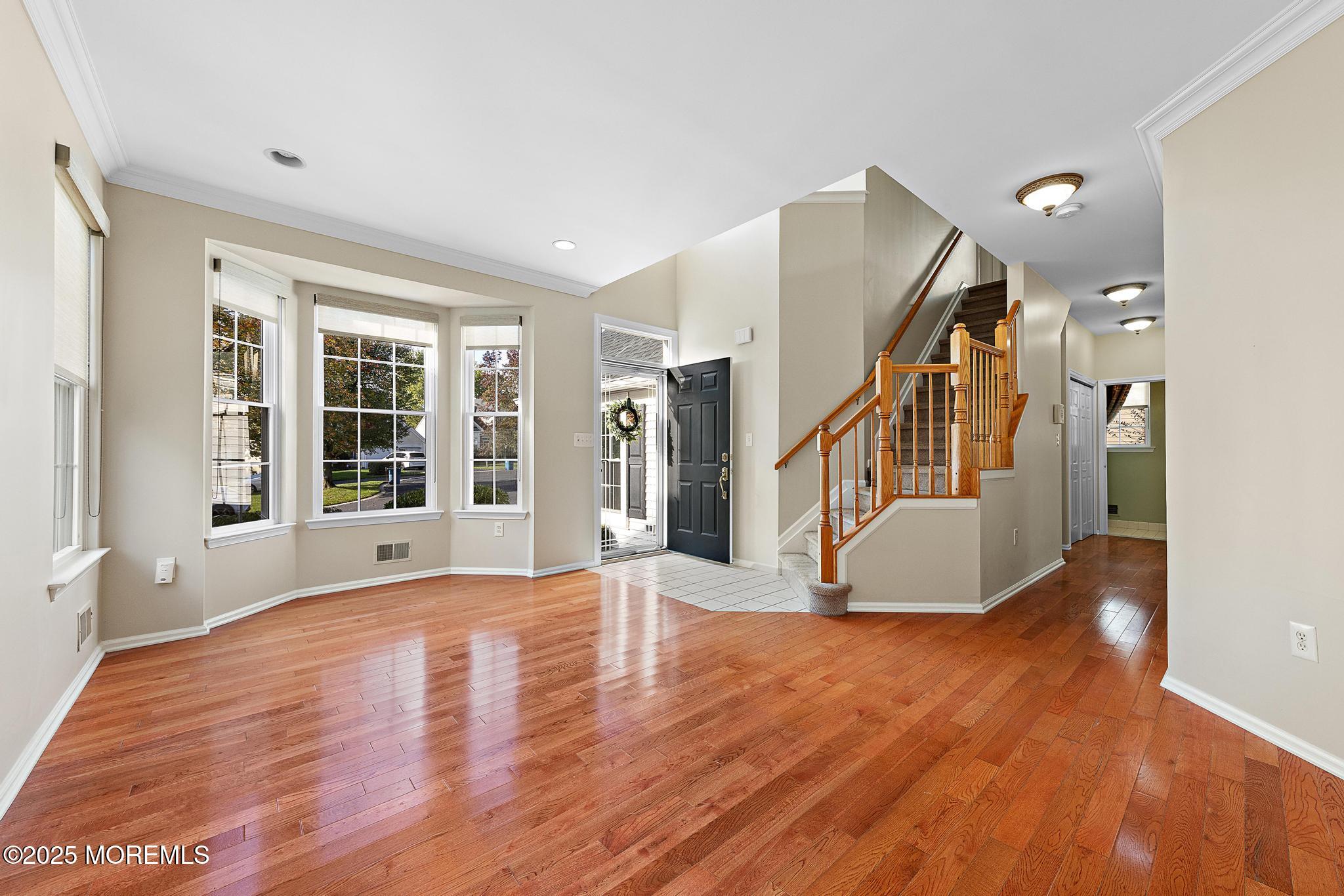 6 Lafayette Colts Neck Colts Neck, NJ 07722 - Photo 4 of 43 a view of an entryway with wooden floor and windows