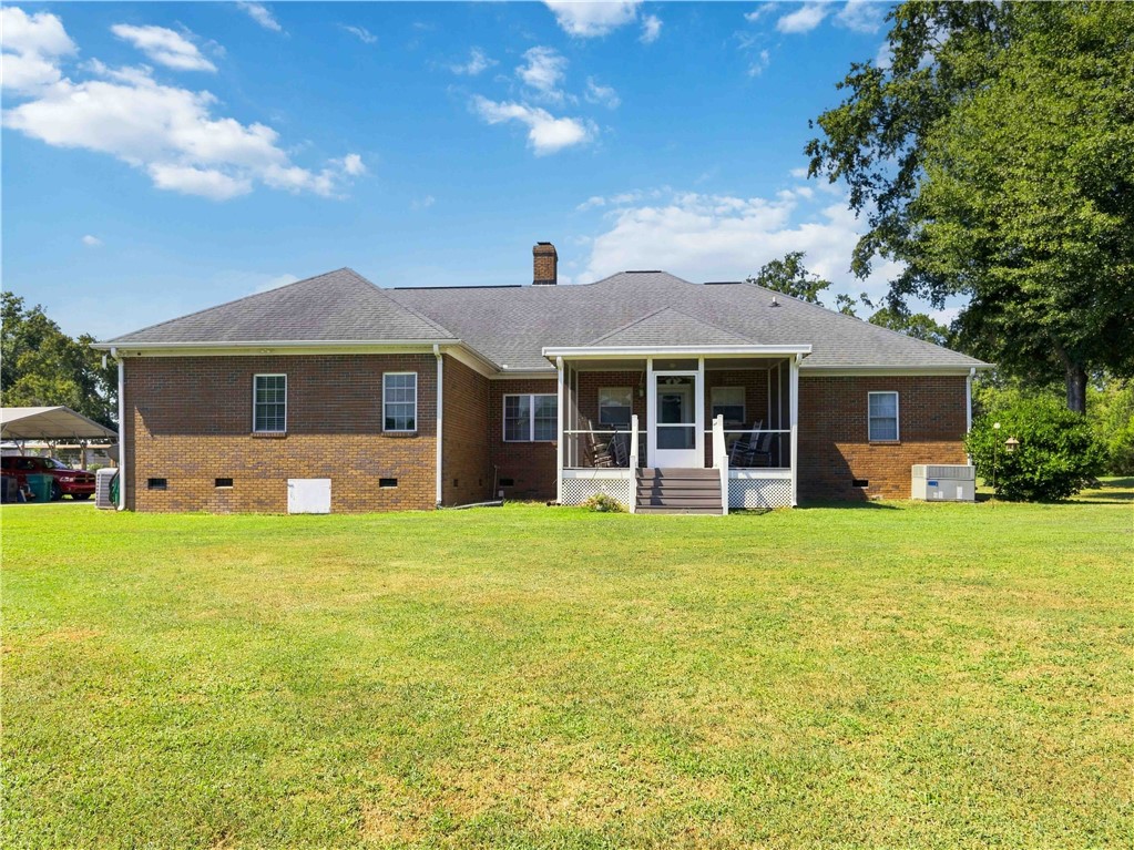 2861 Fairview Road Simpsonville, SC 29680 - Photo 31 of 42 A spacious grassy lawn borders the classic brick exterior and screened porch.