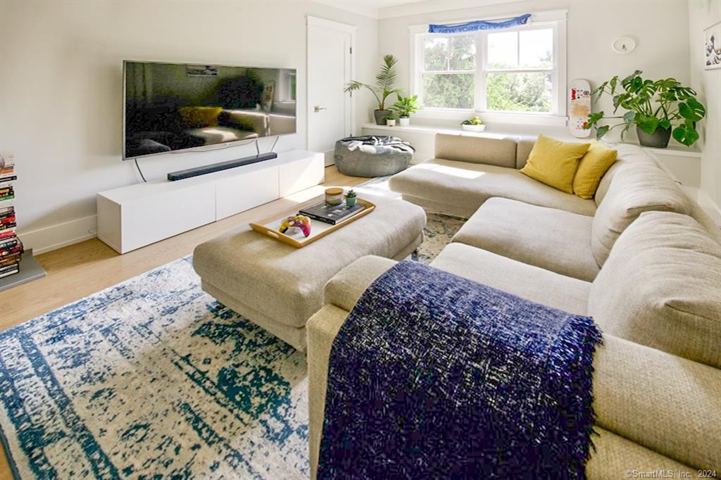 17 Stony Brook Road Westport, CT 06880 - Photo 11 of 39 a living room with furniture and a flat screen tv