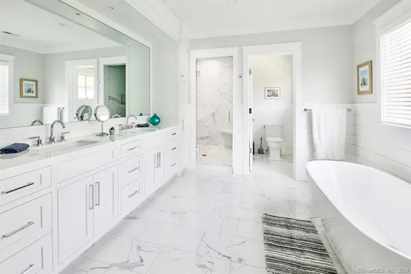 a bathroom with a bathtub and a sink