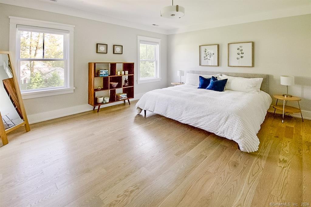 17 Stony Brook Road Westport, CT 06880 - Photo 20 of 39 a bedroom with a large bed and a large window