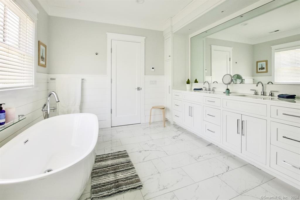 17 Stony Brook Road Westport, CT 06880 - Photo 25 of 39 a bathroom with a bathtub and a sink